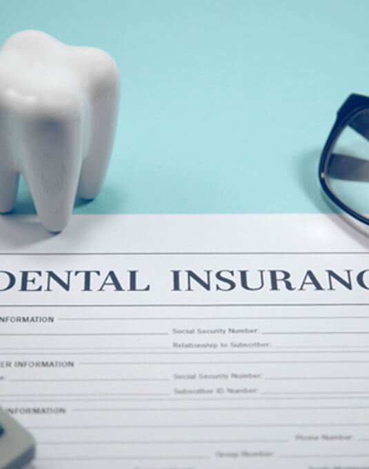 Dental insurance on blue table